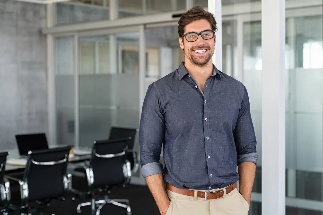 Man smiling in an office