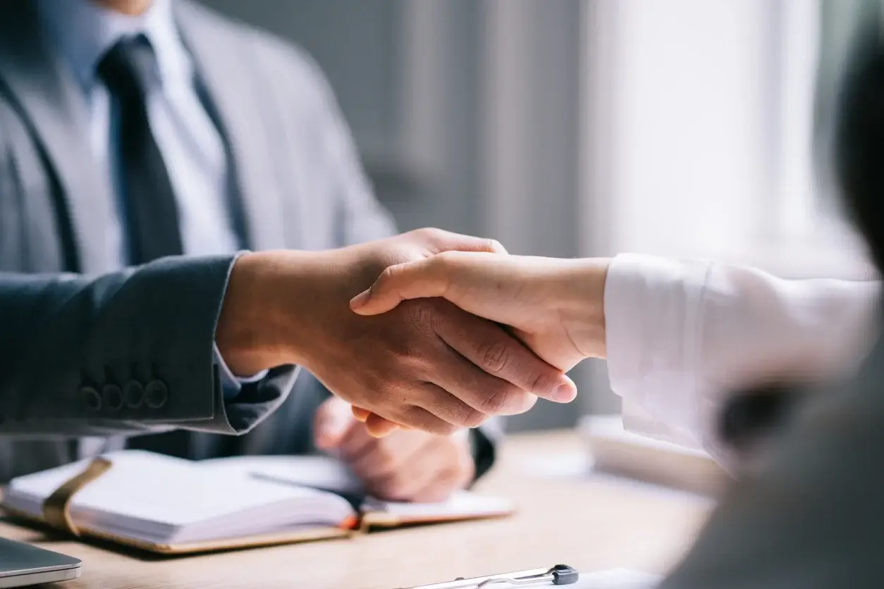 Hiring manager shaking hands with candidate
